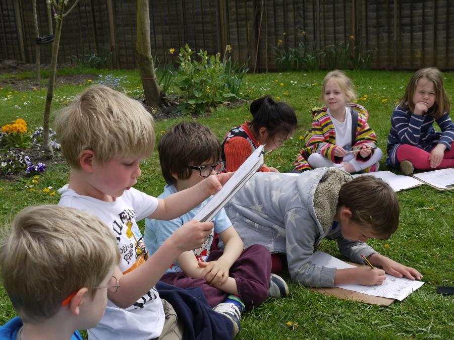 Children drawing outside