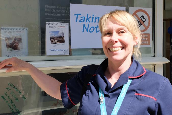 A female member of staff at Addenbrooke's, smiling broadly at the camera. 
